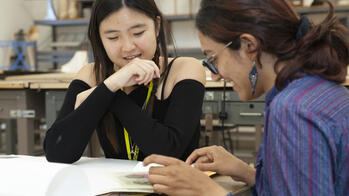 two students together at a desk