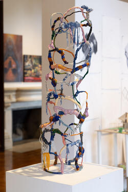 sculpture with brightly colored string