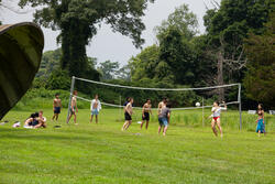 students playing volleyball at Tilinghast place